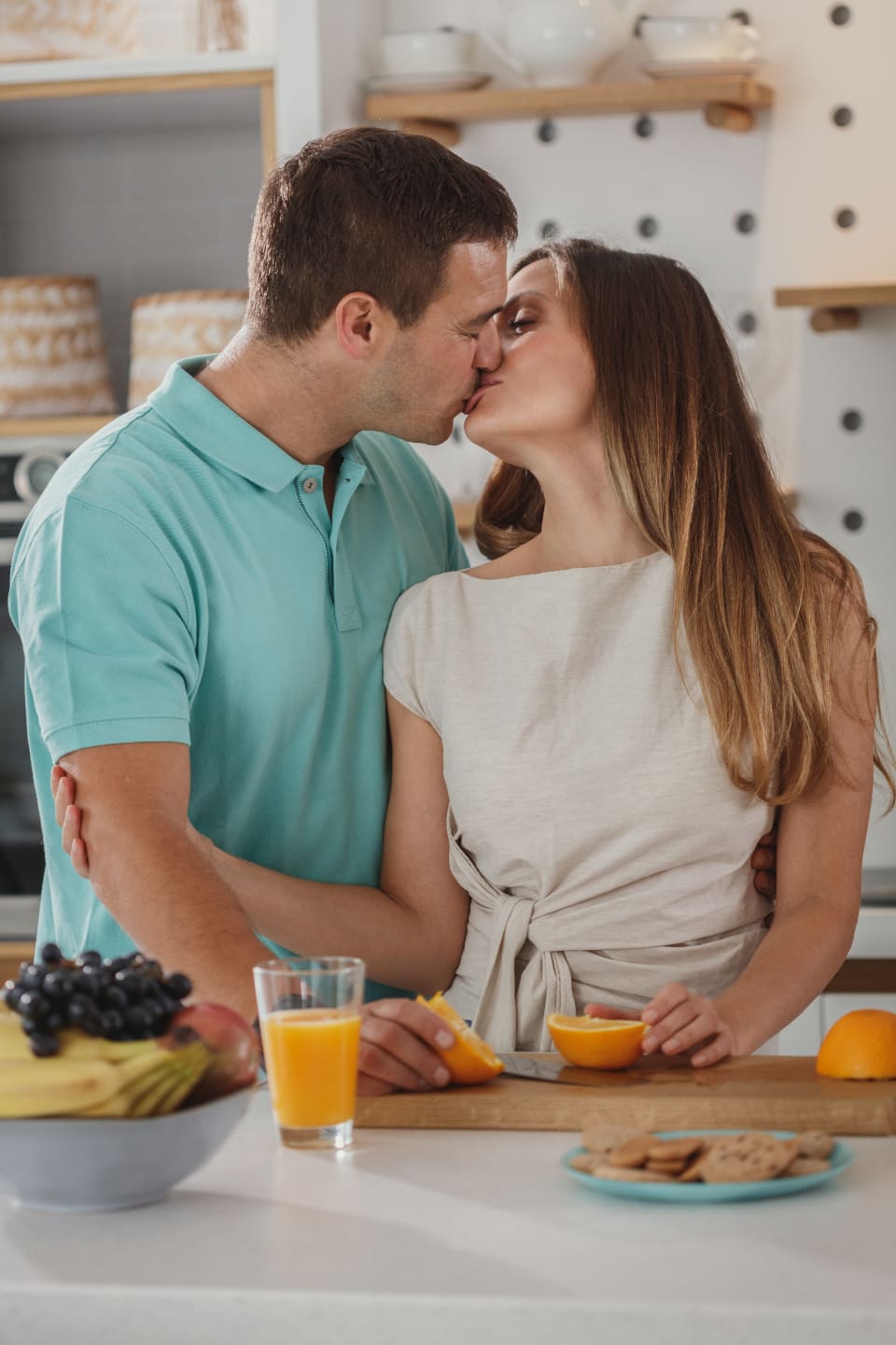 A kiss in the kitchen over breakfast